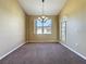 Dining room features a hanging light fixture and tan walls at 205 Minniehaha Cir, Haines City, FL 33844