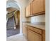 A view of the carpeted stairs and built in cabinets next to the entryway of this home at 205 Minniehaha Cir, Haines City, FL 33844
