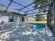 Inviting screened pool with a concrete patio and nice backyard at 205 Minniehaha Cir, Haines City, FL 33844