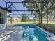 Backyard pool and spa with screened enclosure and view of home exterior and yard at 205 Minniehaha Cir, Haines City, FL 33844