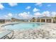 Resort-style pool featuring a sundeck, spacious pool, and a covered lounge area with plenty of seating at 265 Meadowbrook Blvd, Winter Haven, FL 33881