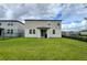 The backyard features a well-maintained lawn at 2943 Sunstar Dr, St Cloud, FL 34772
