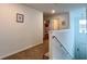Second-floor hallway features neutral walls and carpeting, access to bedrooms, and a staircase to the first floor at 2943 Sunstar Dr, St Cloud, FL 34772