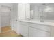 Beautiful primary bathroom with double vanity, tile flooring and walk-in closet at 6381 Clover St, Lake Hamilton, FL 33851