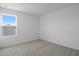 Bright bedroom with large window, neutral walls and soft carpeting at 6381 Clover St, Lake Hamilton, FL 33851