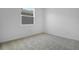 Cozy bedroom with neutral carpet and a bright window at 6381 Clover St, Lake Hamilton, FL 33851