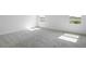 Bright bedroom features soft carpeting, neutral walls and two sunny windows at 6381 Clover St, Lake Hamilton, FL 33851