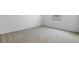 Neutral bedroom with carpeting and a window that lets in ample light at 6381 Clover St, Lake Hamilton, FL 33851