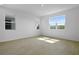 Sunlit bedroom with a large window offering scenic views at 6381 Clover St, Lake Hamilton, FL 33851