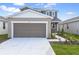Charming home with a two-car garage and manicured lawn at 6381 Clover St, Lake Hamilton, FL 33851