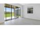 Bright living room with sliding glass doors leading to an outdoor patio at 6381 Clover St, Lake Hamilton, FL 33851