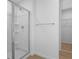 Bathroom with a glass-enclosed shower with tile surround and a shower head at 6381 Clover St, Lake Hamilton, FL 33851