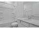 Bathroom featuring a shower-tub, quartz vanity and white cabinetry at 6393 Clover St, Lake Hamilton, FL 33851
