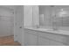 Bathroom featuring a double vanity with quartz countertops and modern fixtures at 6393 Clover St, Lake Hamilton, FL 33851
