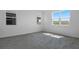 Bedroom featuring tiled floors and sunny windows at 6393 Clover St, Lake Hamilton, FL 33851