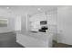 Bright kitchen with white cabinets, stainless steel appliances, and a center island at 6393 Clover St, Lake Hamilton, FL 33851