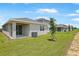 New residential construction featuring a backyard with a lawn and modern homes, emphasizing suburban growth at 6397 Clover St, Lake Hamilton, FL 33851