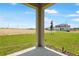 Inviting outdoor view with a spacious green lawn and a clear view of neighboring houses under a blue sky at 6397 Clover St, Lake Hamilton, FL 33851