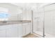Bright bathroom featuring double vanity with modern sinks and spacious glass enclosed shower at 6397 Clover St, Lake Hamilton, FL 33851