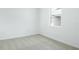 Empty bedroom with carpet and a window showing natural light, creating a blank canvas at 6397 Clover St, Lake Hamilton, FL 33851