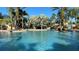 Inviting community pool with palm trees and relaxing atmosphere at 1251 Radiant St, Reunion, FL 34747