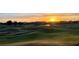 Picturesque golf course view at sunset, surrounded by homes at 1251 Radiant St, Reunion, FL 34747
