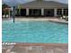 A beautiful community pool with a splash area, lounge chairs, and a covered pavilion for relaxing by the water at 1907 Partin Terrace Rd, Kissimmee, FL 34744