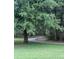 A tranquil walking path winds through lush greenery, offering a serene environment for leisurely strolls and outdoor enjoyment at 1907 Partin Terrace Rd, Kissimmee, FL 34744