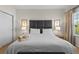 Comfortable bedroom with a luxurious bed and linens, plus a beautiful view from the window at 2618 Roadster Ln, Kissimmee, FL 34746