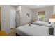 Bedroom featuring two twin beds with yellow accents and a window overlooking the lawn at 2618 Roadster Ln, Kissimmee, FL 34746