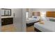 A bedroom featuring two beds, each with a window and connected to the bathroom at 2618 Roadster Ln, Kissimmee, FL 34746