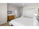 Spacious bedroom with a king bed, a dresser, and a cozy ambiance at 2618 Roadster Ln, Kissimmee, FL 34746