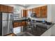 Well-appointed kitchen features sleek countertops, modern appliances, and ample cabinet space at 2618 Roadster Ln, Kissimmee, FL 34746