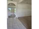 Inviting foyer with tile flooring transitioning to plush carpeting in the adjacent living spaces at 273 Sofia Ln, Lake Alfred, FL 33850