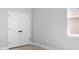 Bedroom with a window and double door closet, creating a bright and versatile space at 308 Miami Ln, Kissimmee, FL 34759