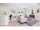 Bright living room with stylish decor, a neutral sofa, and sliding glass doors offering ample natural light at 308 Miami Ln, Kissimmee, FL 34759