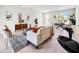 Inviting living area featuring modern furnishings and an open layout connected to the kitchen at 308 Miami Ln, Kissimmee, FL 34759