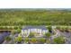 Apartment complex with lush greenery, parking, and lakeside views offers a serene living environment at 3176 Feltrim Pl # 202, Kissimmee, FL 34747