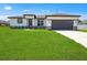 Charming single-story home with a well-manicured lawn and stone accents at 370 Marion Oaks Crse, Ocala, FL 34473