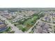 An aerial view of the neighborhood showcasing the community park and surrounding homes at 4710 Nathan Hale Blvd, St Cloud, FL 34769