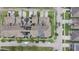 Aerial view of townhomes featuring solar panels, landscaping, and ample parking at 4710 Nathan Hale Blvd, St Cloud, FL 34769