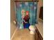 Bathroom with a themed shower curtain, tile floors, and standard fixtures at 4710 Nathan Hale Blvd, St Cloud, FL 34769