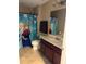 Well-maintained bathroom featuring a shower with a themed curtain, vanity, and toilet at 4710 Nathan Hale Blvd, St Cloud, FL 34769