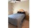 Bedroom featuring carpeted floors, a comfortable bed, and natural wood accents at 4710 Nathan Hale Blvd, St Cloud, FL 34769