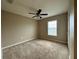Bedroom with carpet floors, a ceiling fan, and a window for natural light at 4710 Nathan Hale Blvd, St Cloud, FL 34769