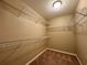 Walk in closet featuring carpeted floor and wire shelves at 4710 Nathan Hale Blvd, St Cloud, FL 34769
