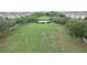 A serene community park featuring mature trees, benches, and a central gathering area at 4710 Nathan Hale Blvd, St Cloud, FL 34769