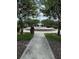 Picturesque community park with mature trees, walkways, and benches providing a serene outdoor space for residents at 4710 Nathan Hale Blvd, St Cloud, FL 34769