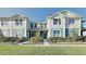 Inviting townhome with manicured lawn, complemented by neat landscaping and a bright, sunny sky at 4710 Nathan Hale Blvd, St Cloud, FL 34769