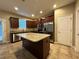 Modern kitchen with granite countertops, stainless steel appliances, and a center island at 4710 Nathan Hale Blvd, St Cloud, FL 34769